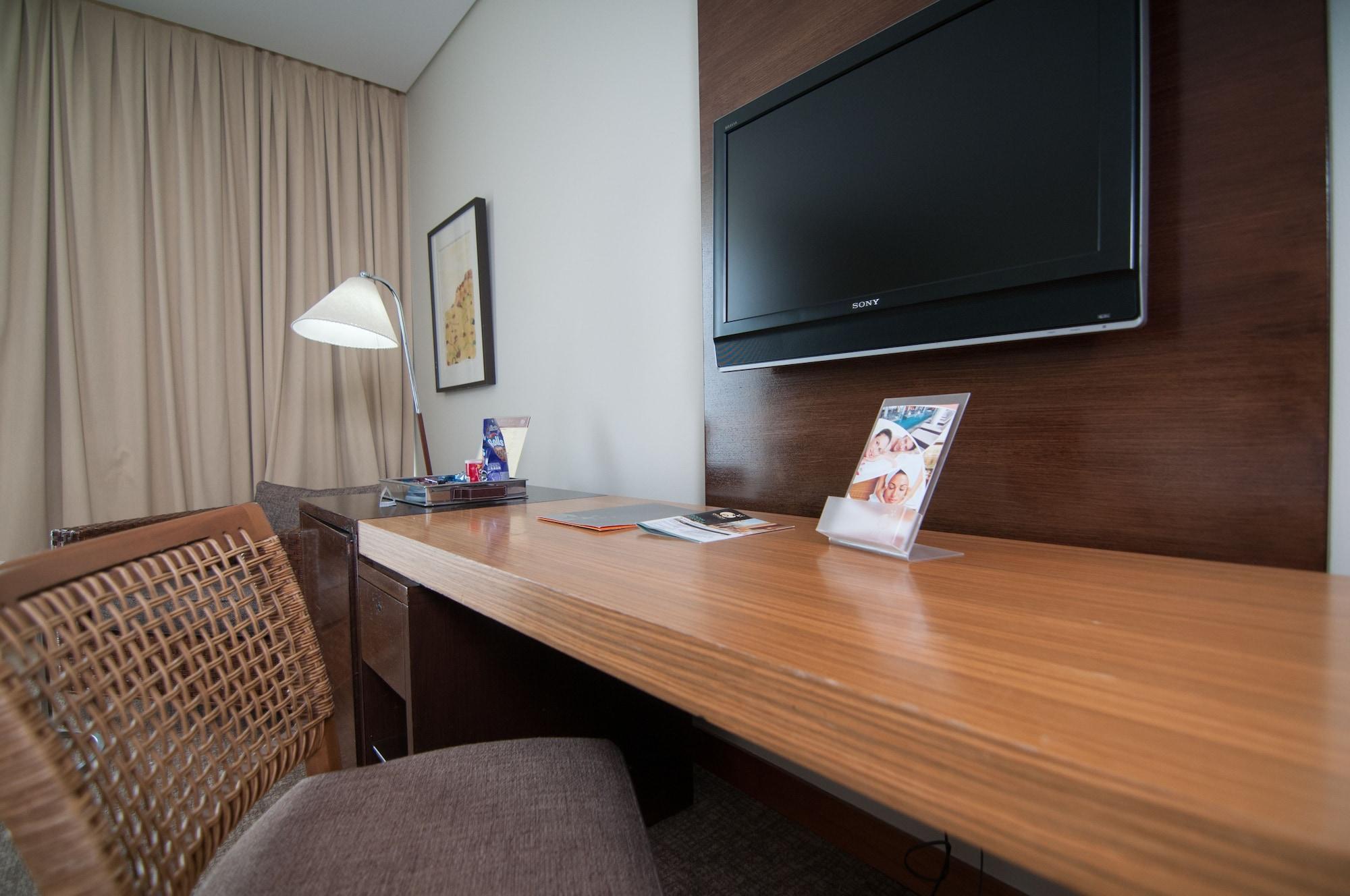 Отель Enjoy Кокимбо Экстерьер фото A television in a hotel room